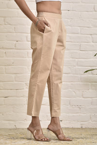 Beige stretchable pants with elastic