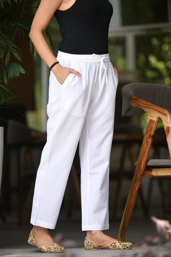Off-white linen cotton pants for women, breathable and perfect for casual wear, with pockets and elasticated waistband.