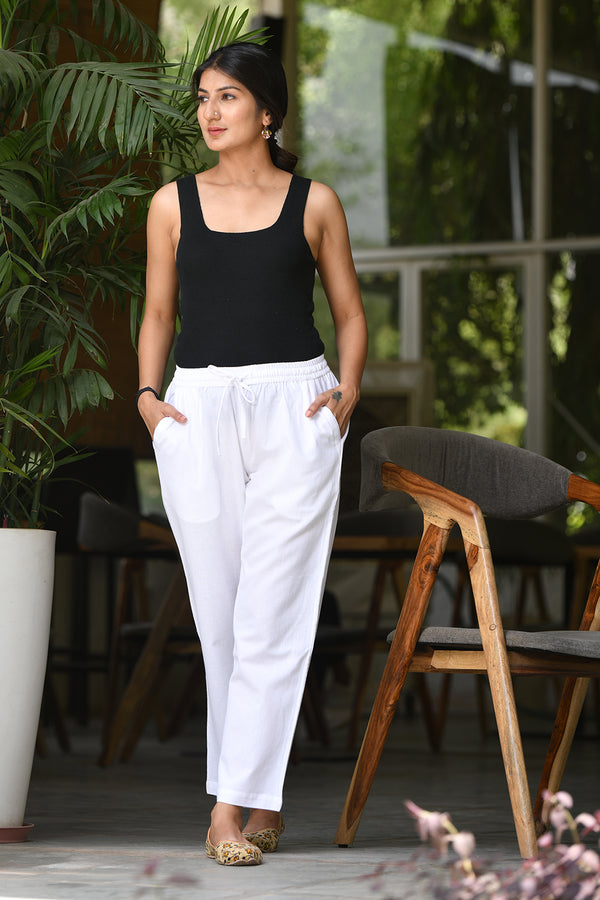 Off-white linen cotton pants for women, breathable and perfect for casual wear, with pockets and elasticated waistband.